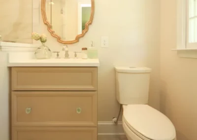 Simple bathroom renovation by Oak Ridge Builders with a natural vanity and toilet