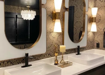 Custom bathroom renovation by Oak Ridge Builders with black and gold accents